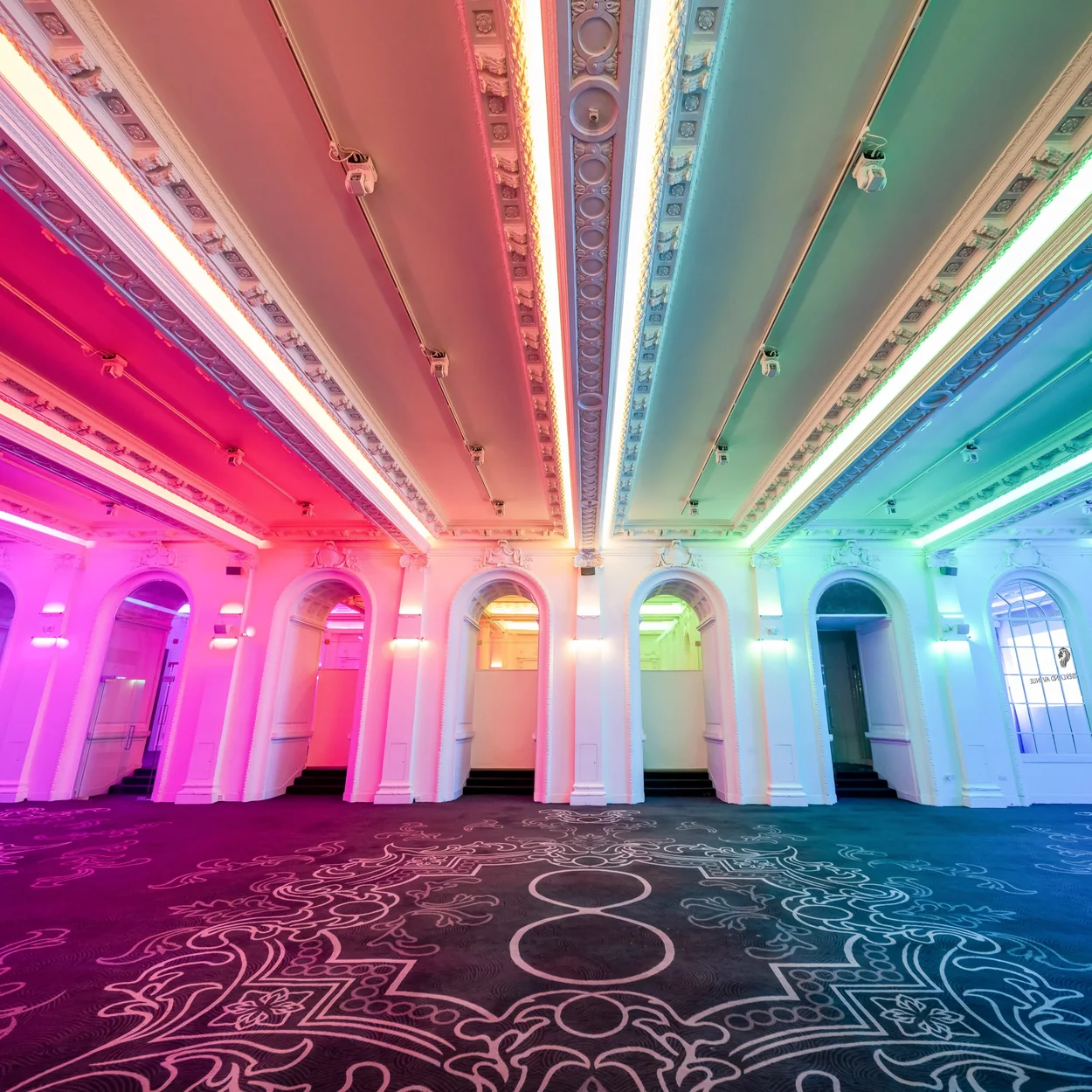 8 Northumberland Avenue event space with arched windows and neon lighting