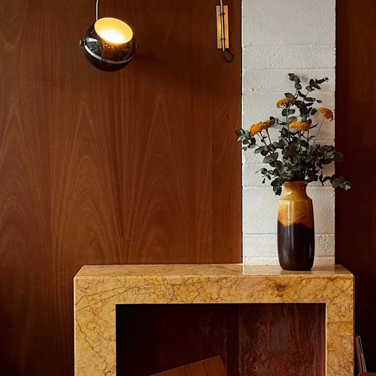 Abuelo dining room corner with timber panelling and marble table