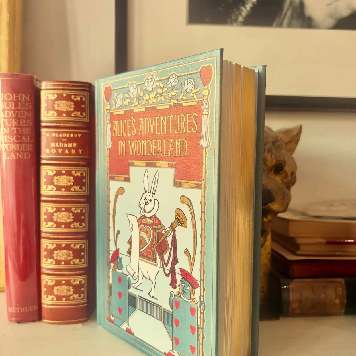 Alice Through the Looking Glass illustrated Alice edition displayed on a shelf in the shop