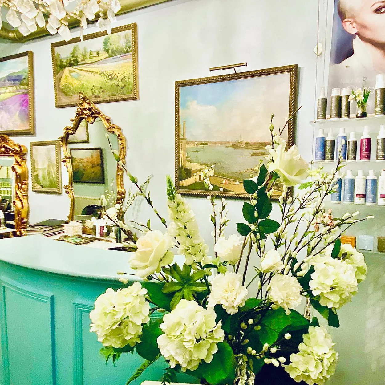 Alterity Studio reception with fresh flowers and organic hair care products