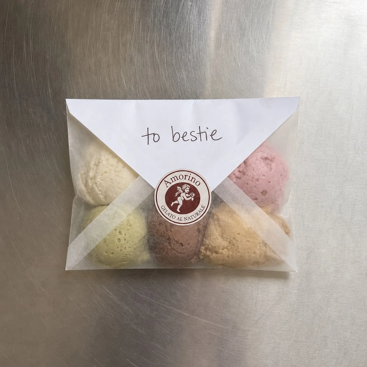 Amorino gelato macarons in a branded gift pouch
