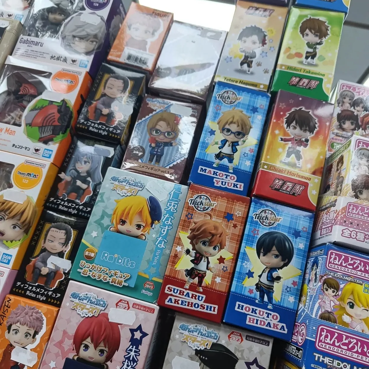 Animetal shelves stacked with boxed anime figures and Nendoroids