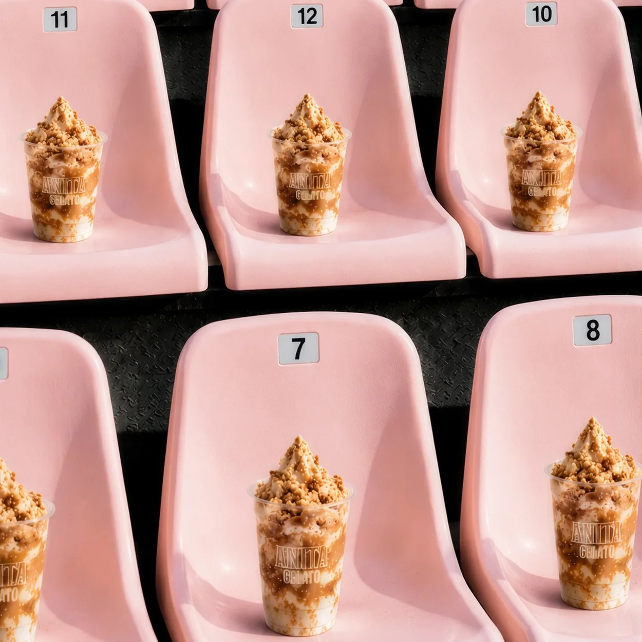 Anita Gelato soft serve cones arranged on pink seats