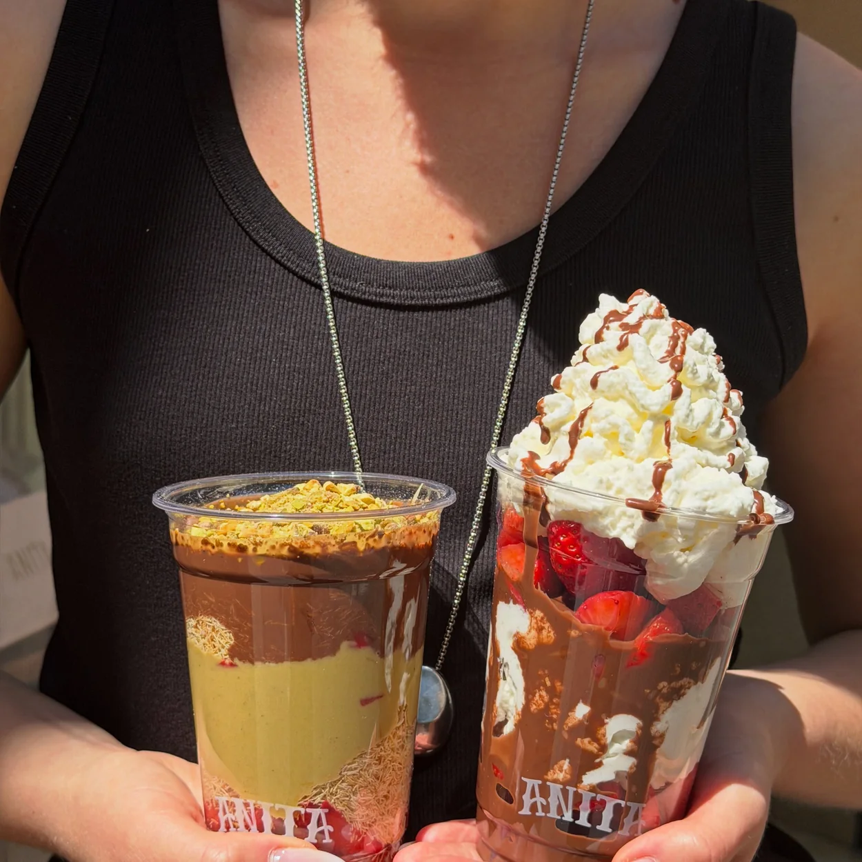 Anita Gelato two layered sundae cups with cream and strawberries