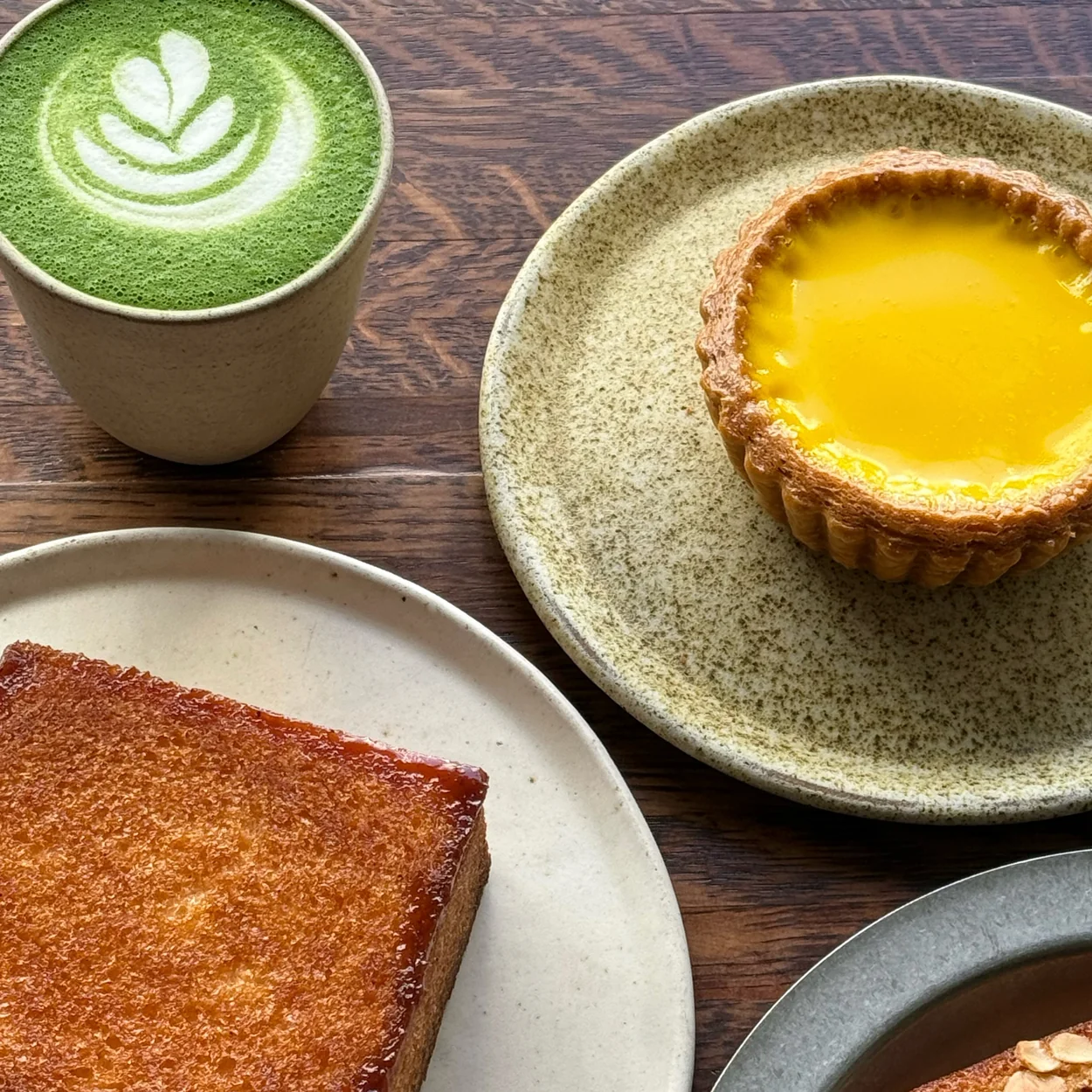Arôme Bakery matcha latte, egg tart and honey butter toast on the table