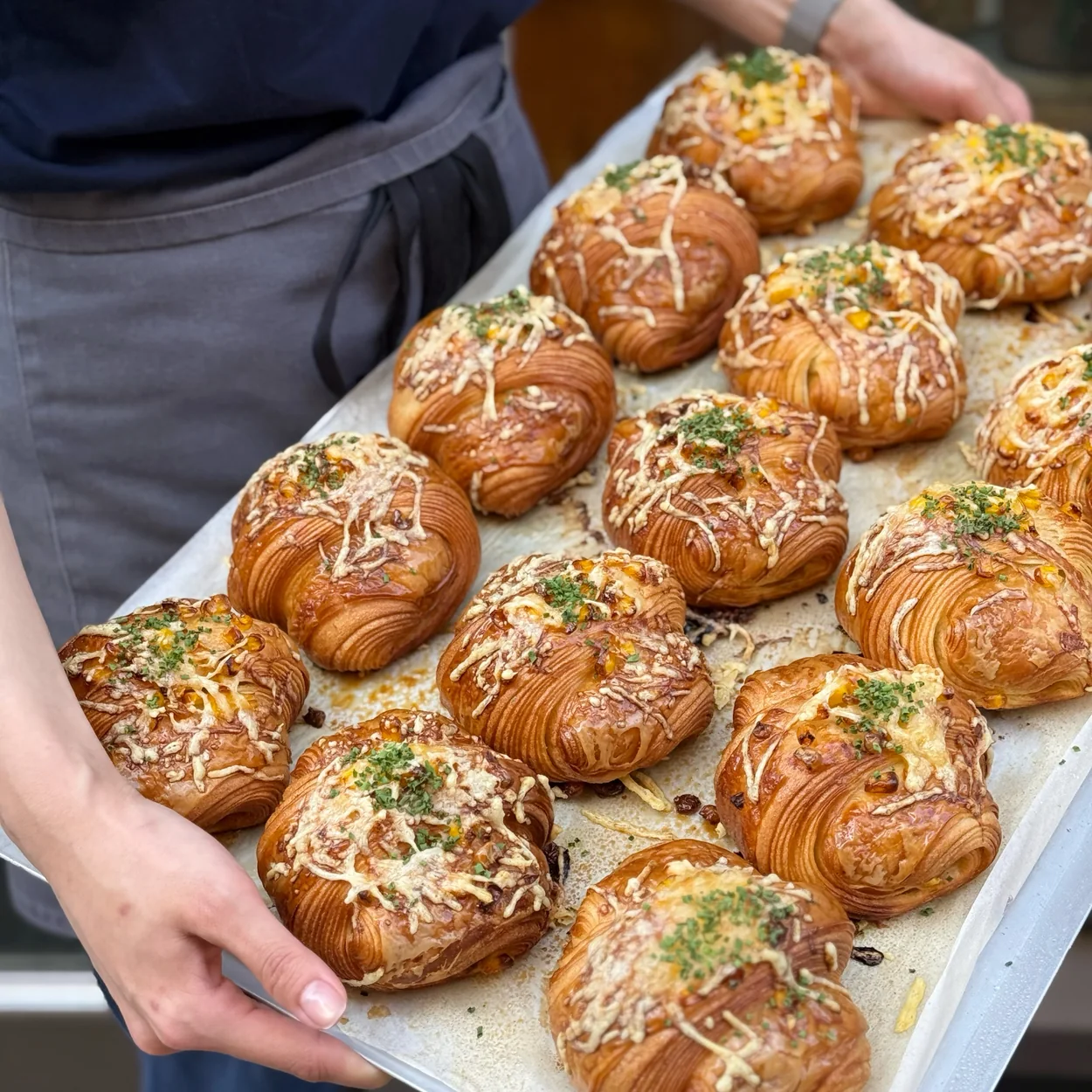 Arôme Bakery tray of savoury cheese-topped croissants