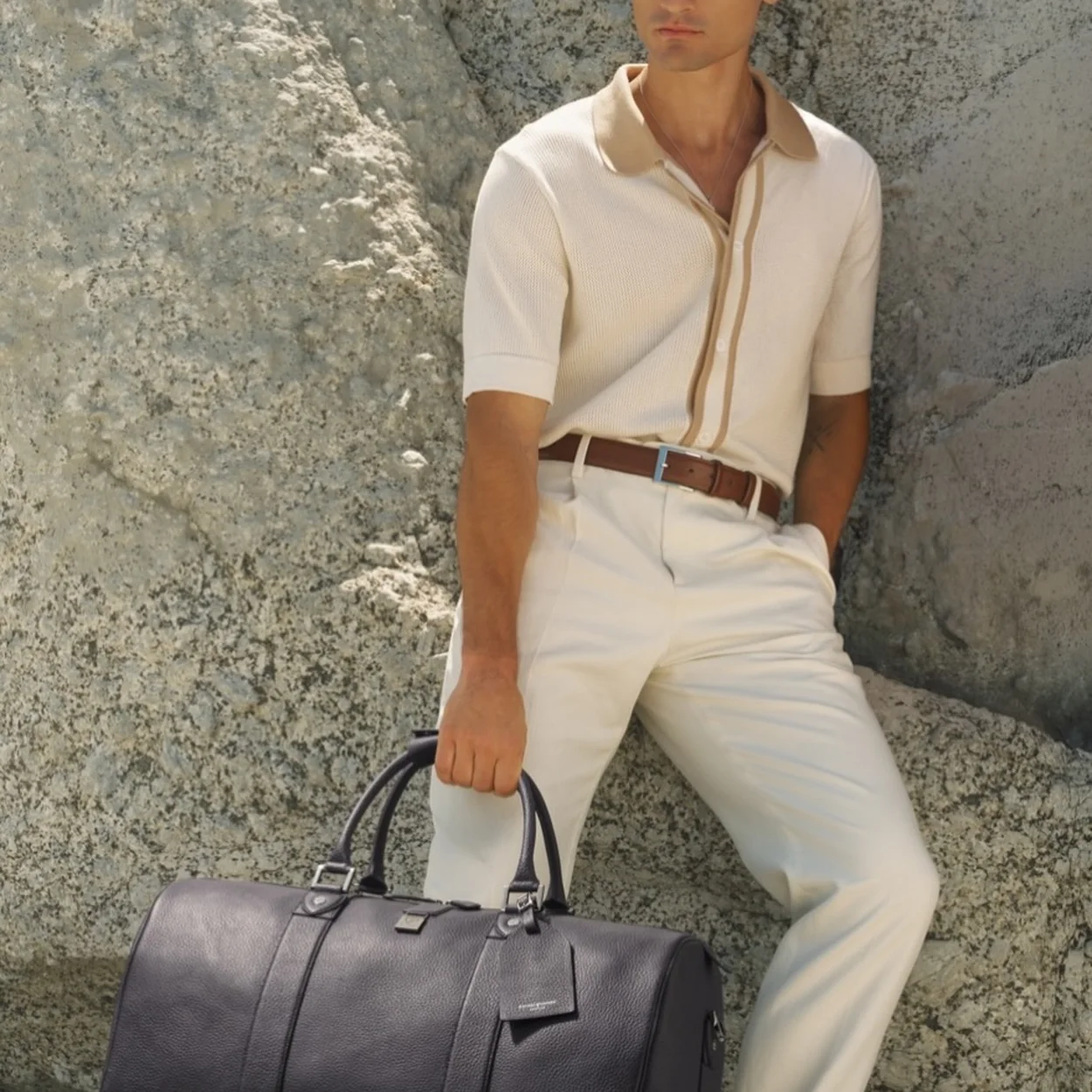 Aspinal of London black leather weekend holdall carried by hand