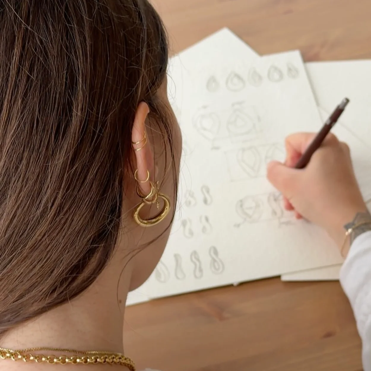 Astrid & Miyu designer sketching new jewellery designs