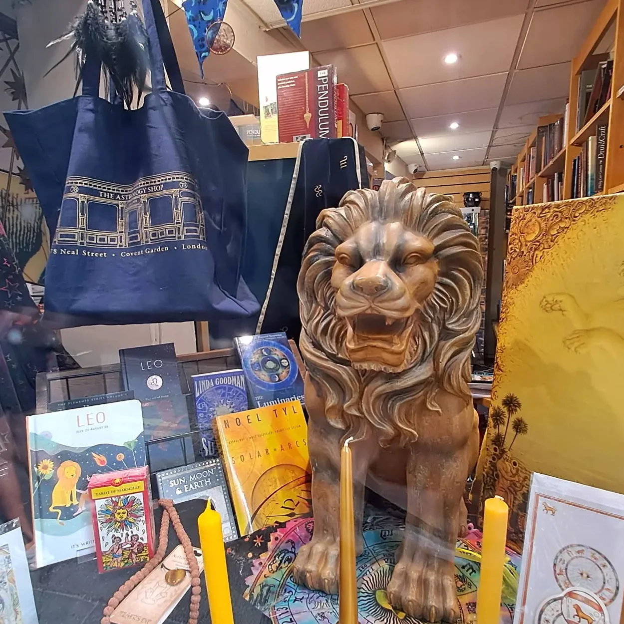 The Astrology Shop interior display with tote bags, books and candles