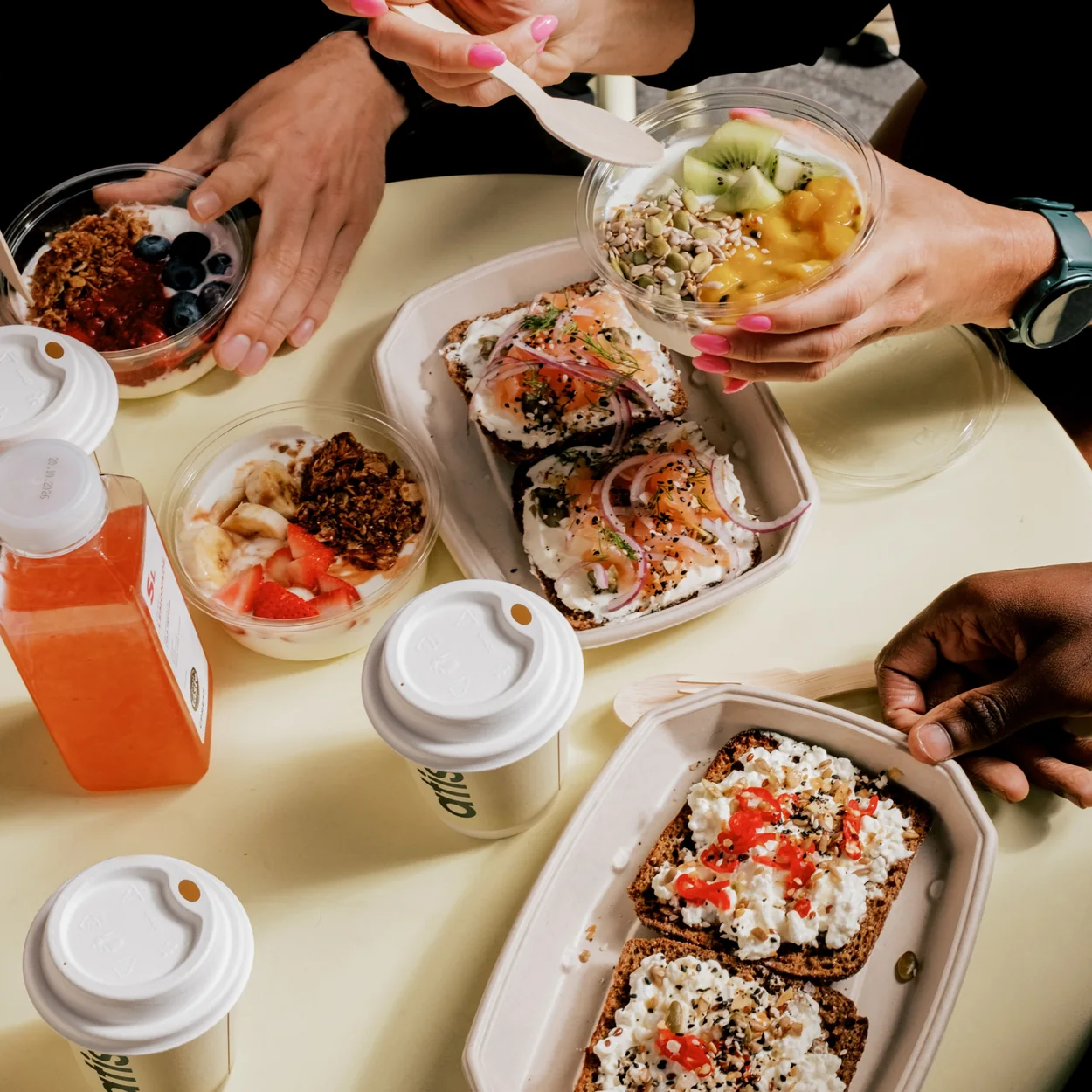 Atis breakfast spread of toasts, bowls, coffees and juice