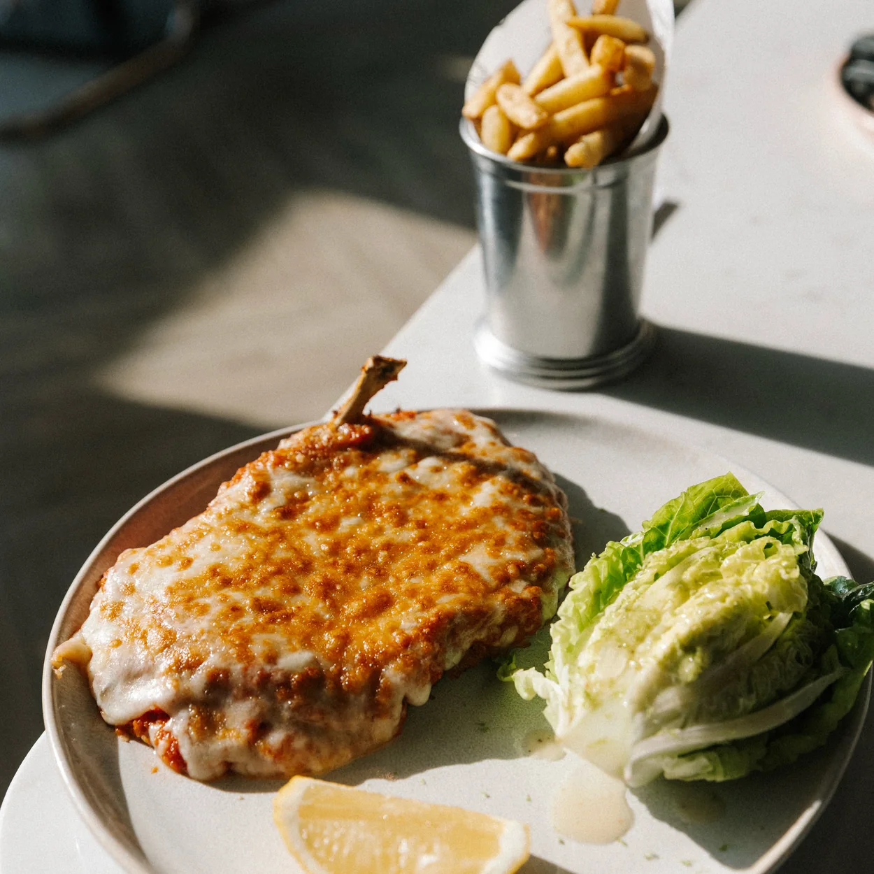 Audrey Green chicken schnitzel with fries and lemon (Daisy Green Collection)