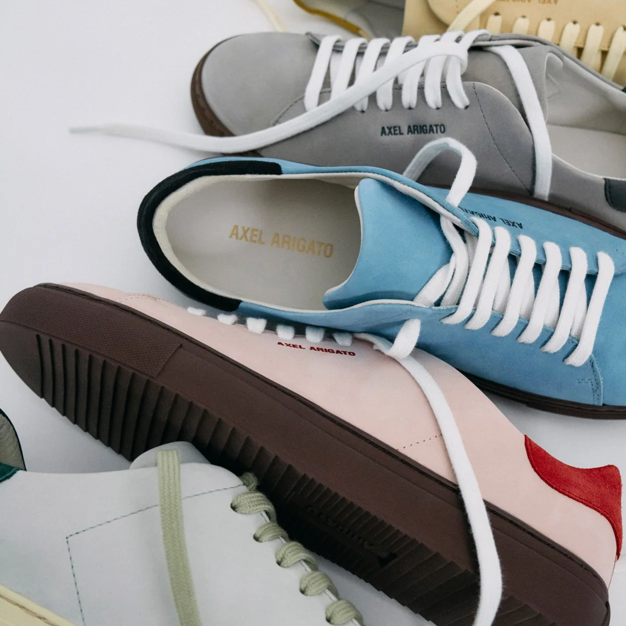 Axel Arigato low-top trainers in grey, blue, pink and white