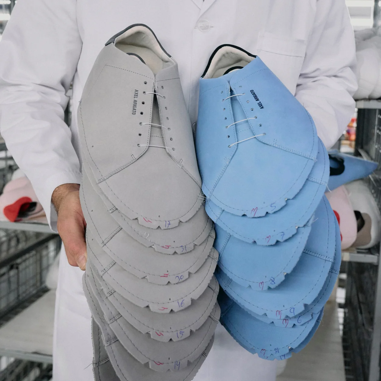 Axel Arigato suede trainers being assembled in the workshop