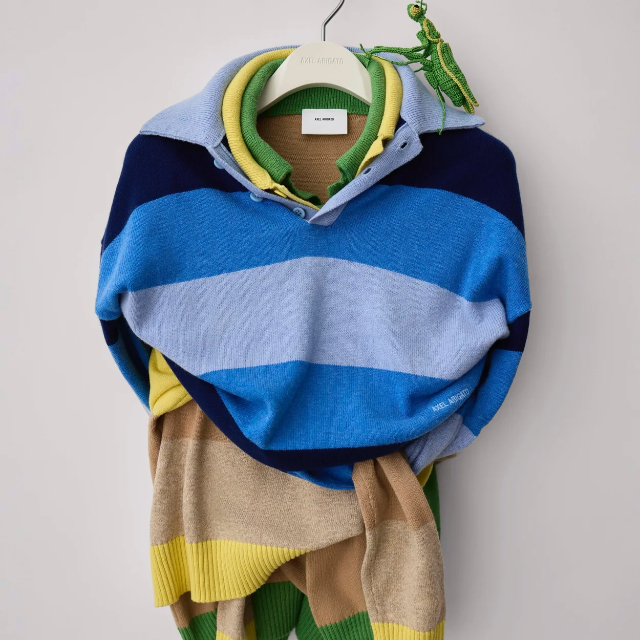 Axel Arigato striped knitwear on a hanger