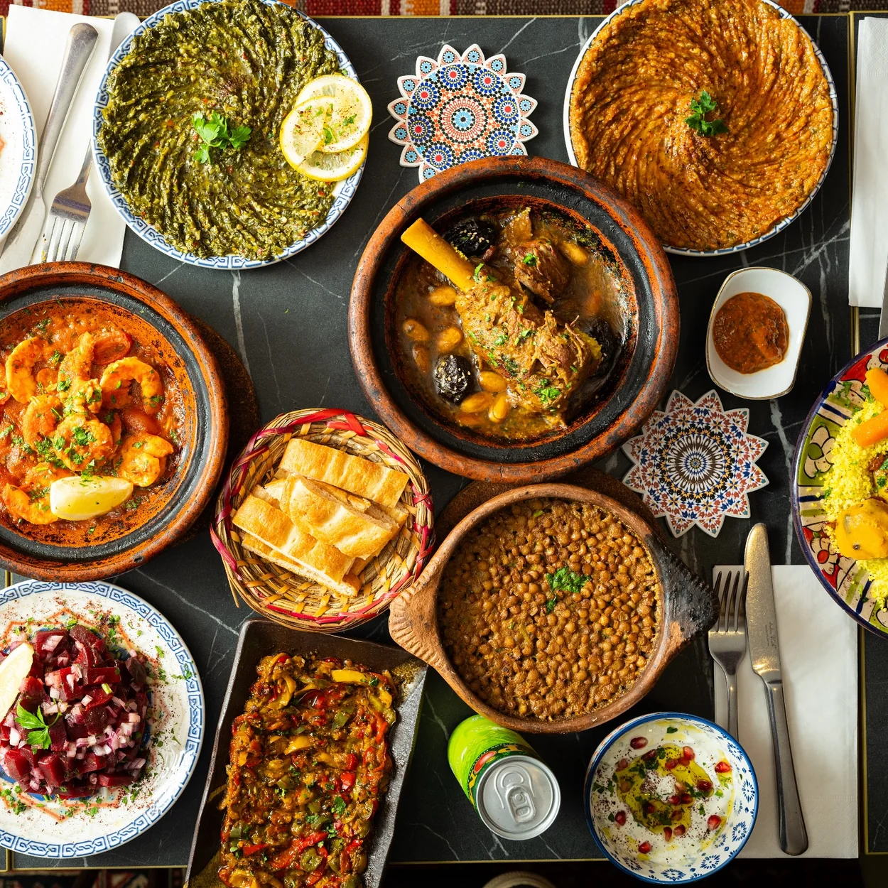 Bab Mansour table spread of Moroccan mezze and tagines