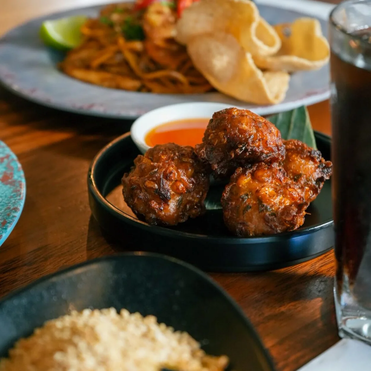 Banana Tree sticky glazed chicken bites with rice and noodles
