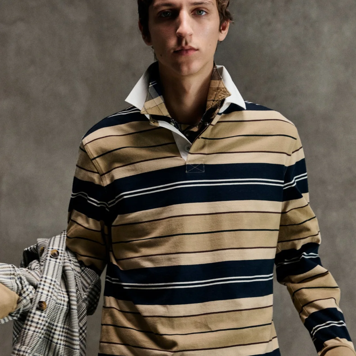 Barbour striped rugby shirt worn with a check jacket