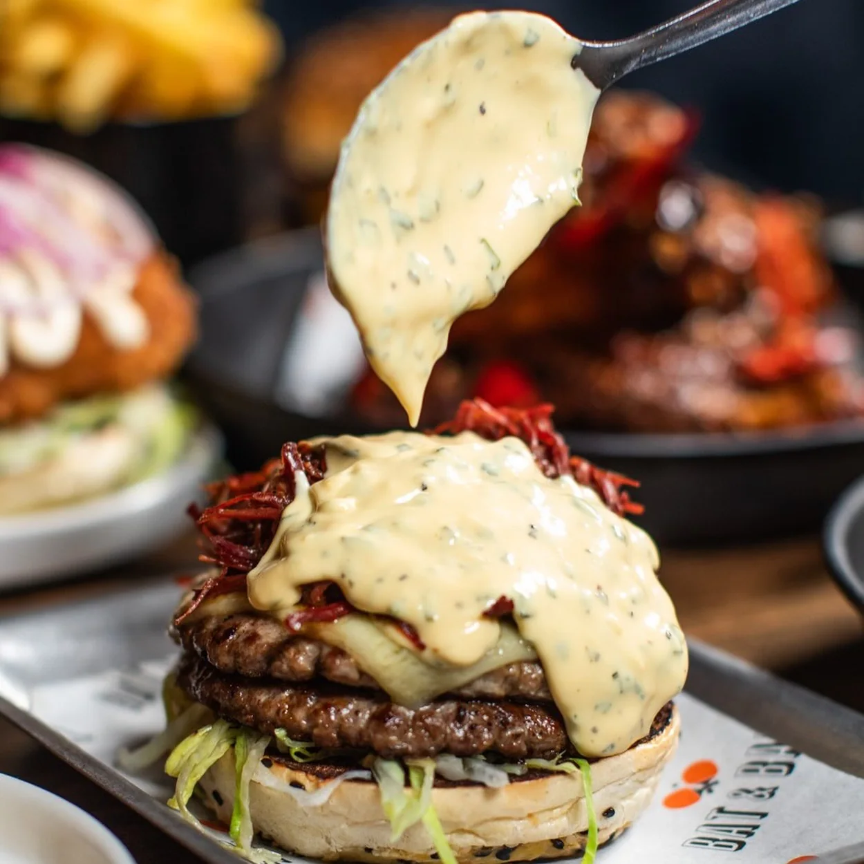 Bat & Ball burger with melted cheese and fries