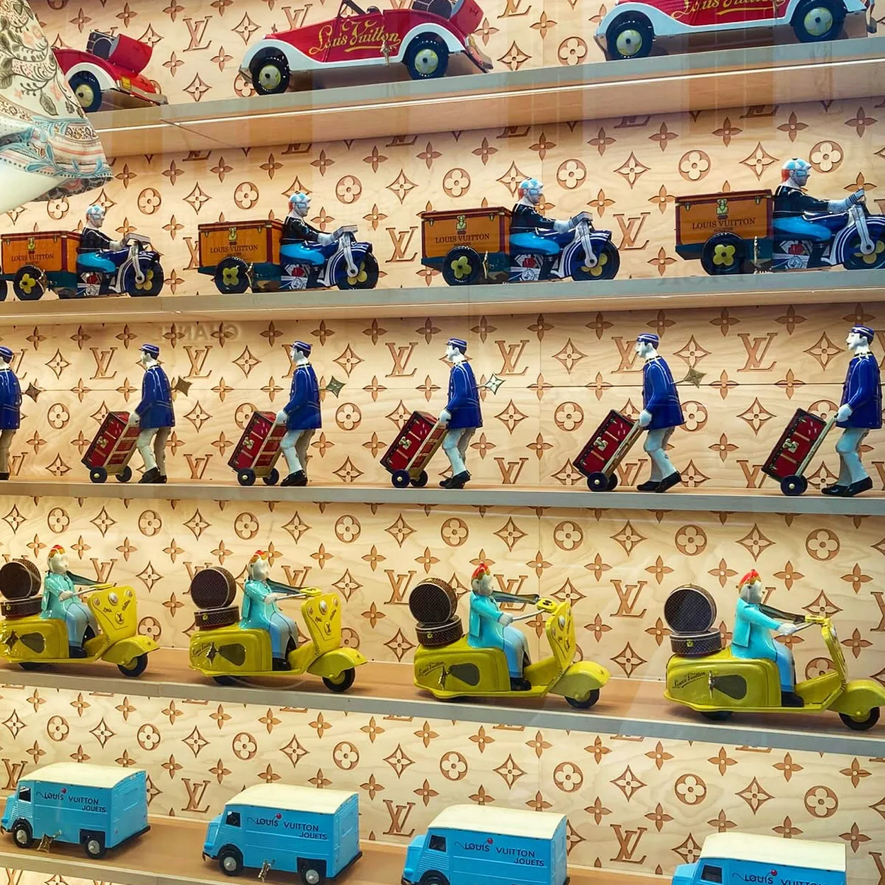Benjamin Pollock's Toyshop tin toy cars and vans on display