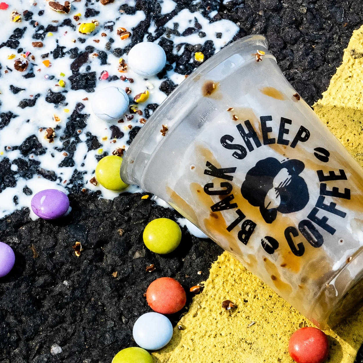 Black Sheep Coffee iced coffee cup with chocolate sweets