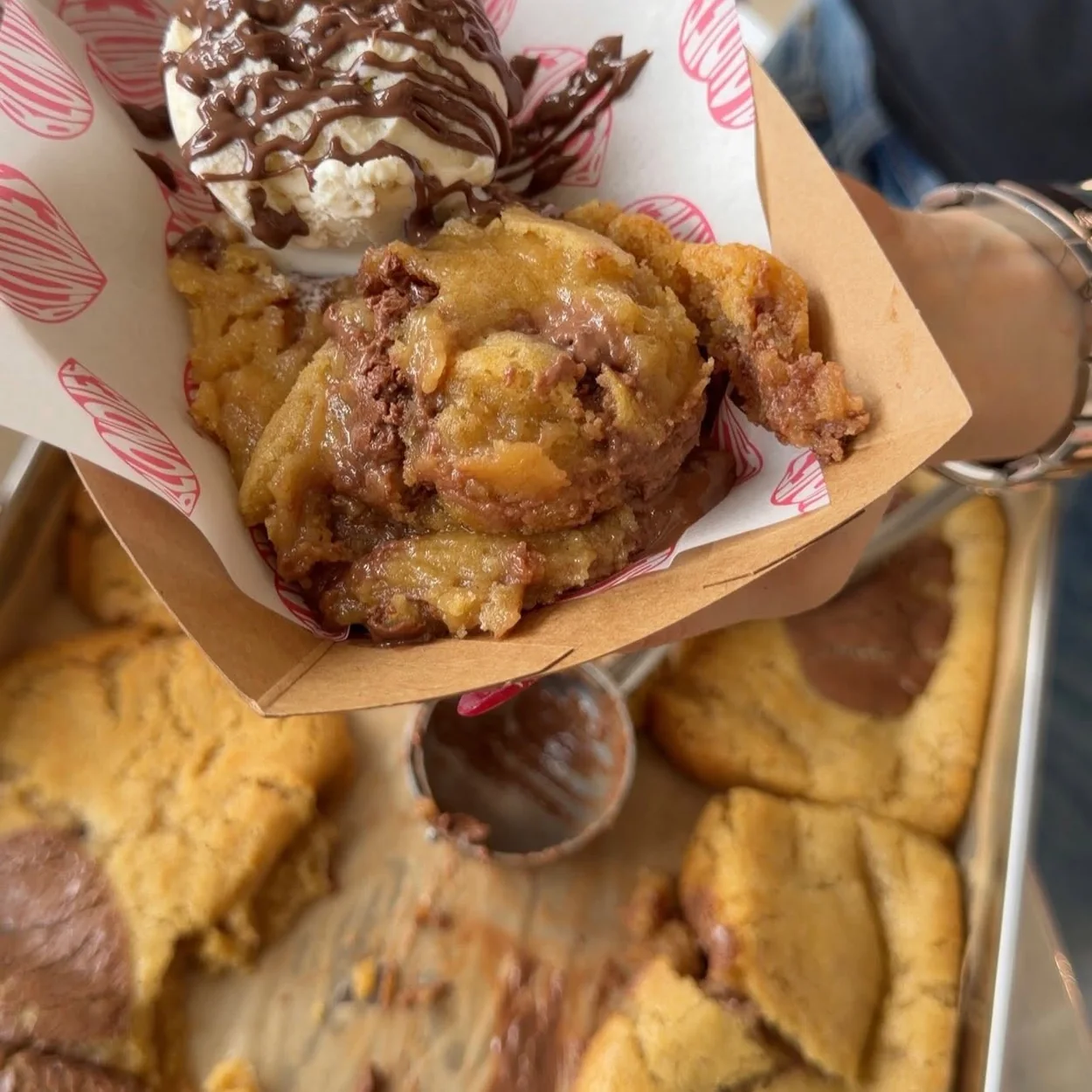Blondies Kitchen cookie tray being scooped to order