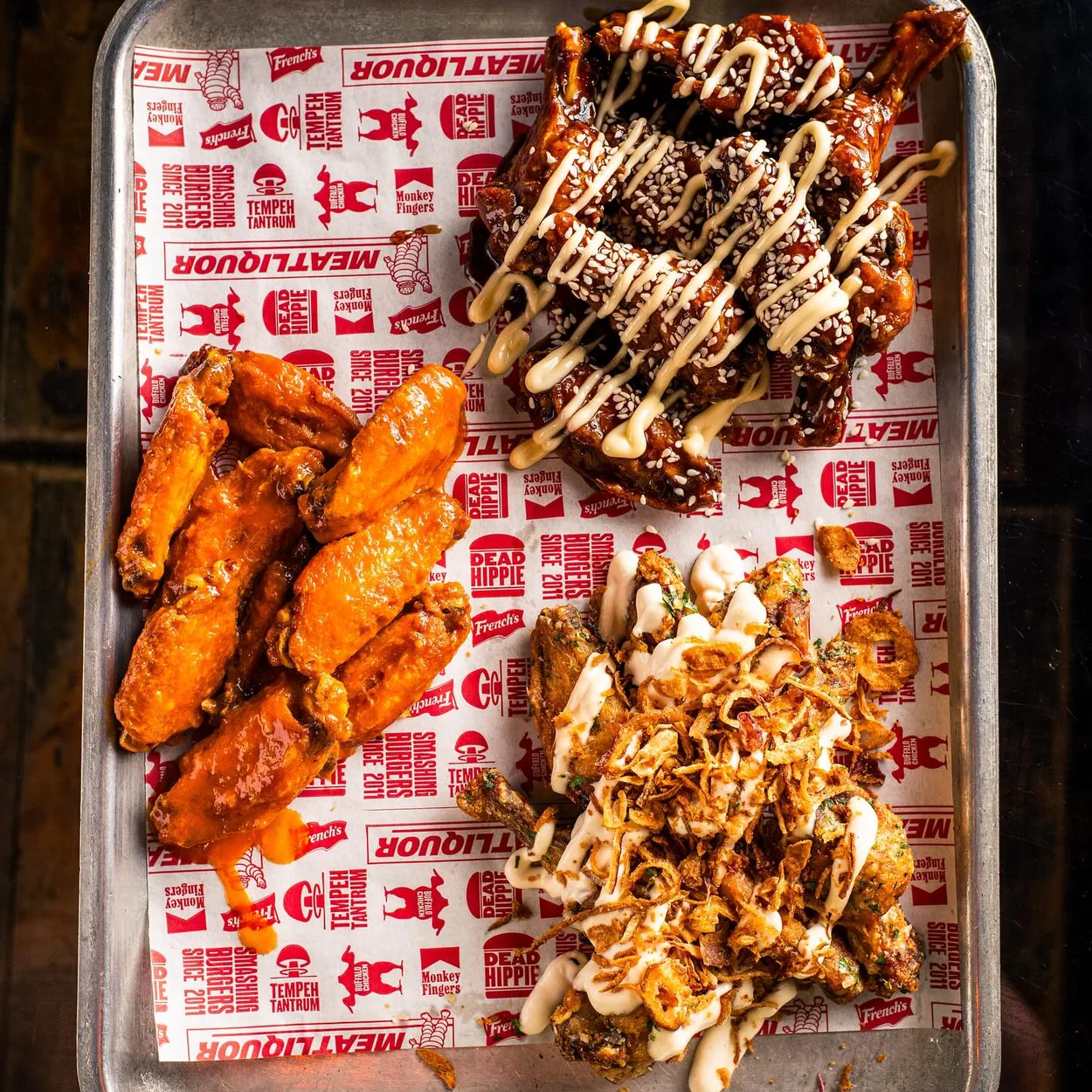 BLOODsports MEATliquor tray of wings and loaded fries