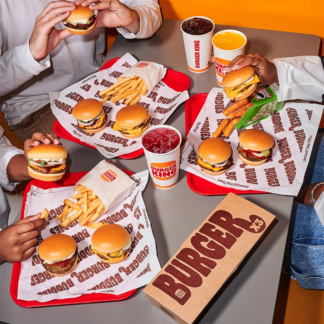 Burger King burgers and fries shared across a table