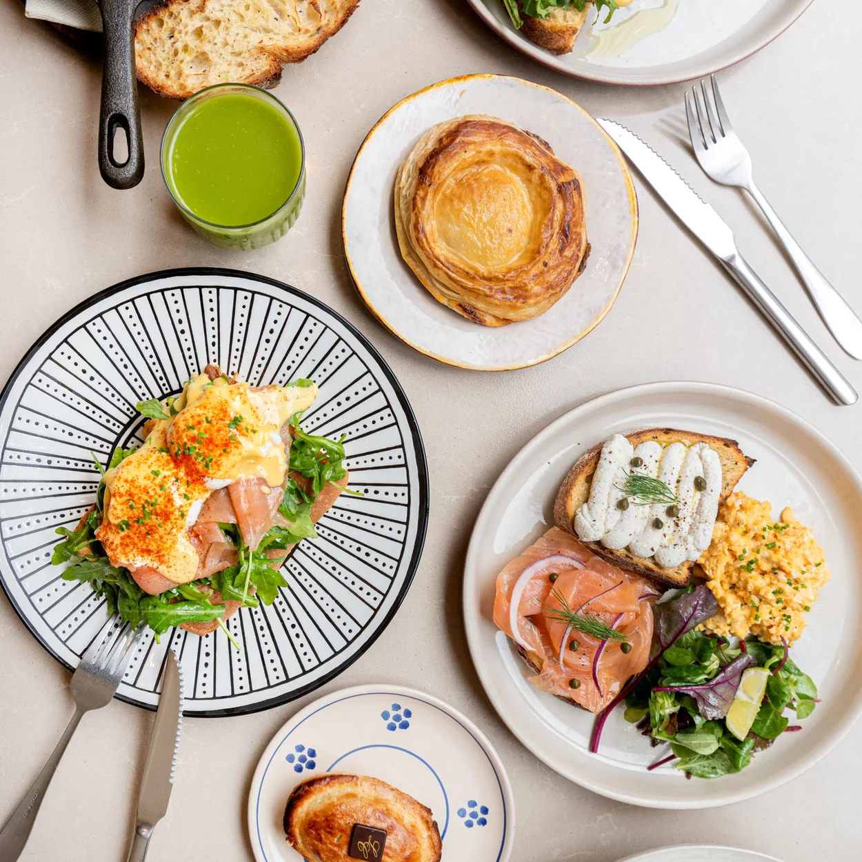Capilungo brunch spread with eggs, pastries and green juice