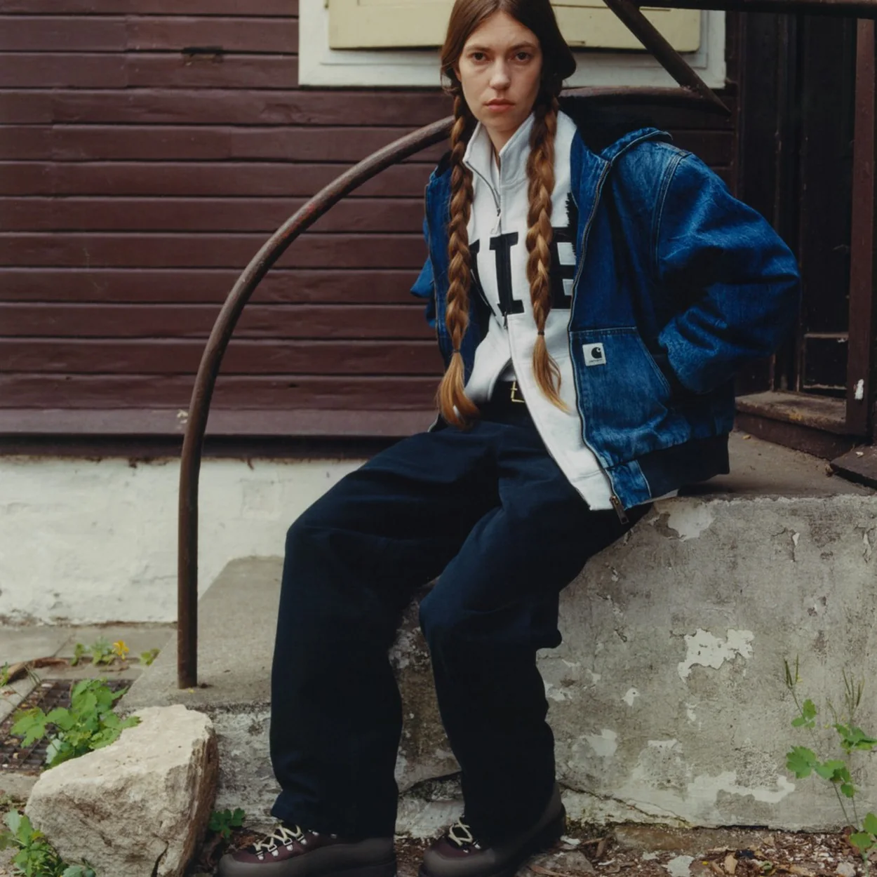 Carhartt WIP denim jacket and trousers worn on outdoor steps