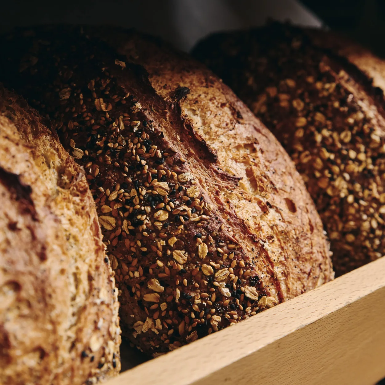 Chestnut Bakery seeded sourdough loaves on the bread shelf