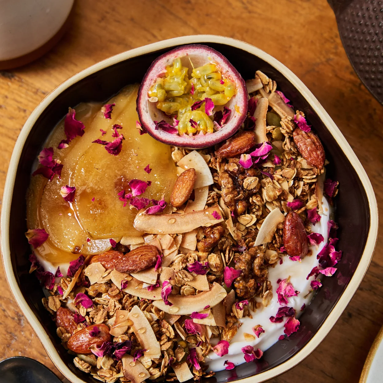 Chestnut Bakery granola bowl with passion fruit and rose petals