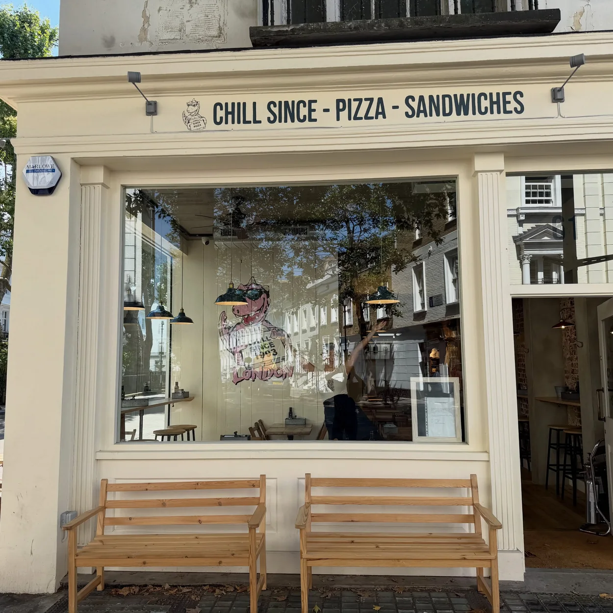 Chill Since '93 shopfront with benches outside