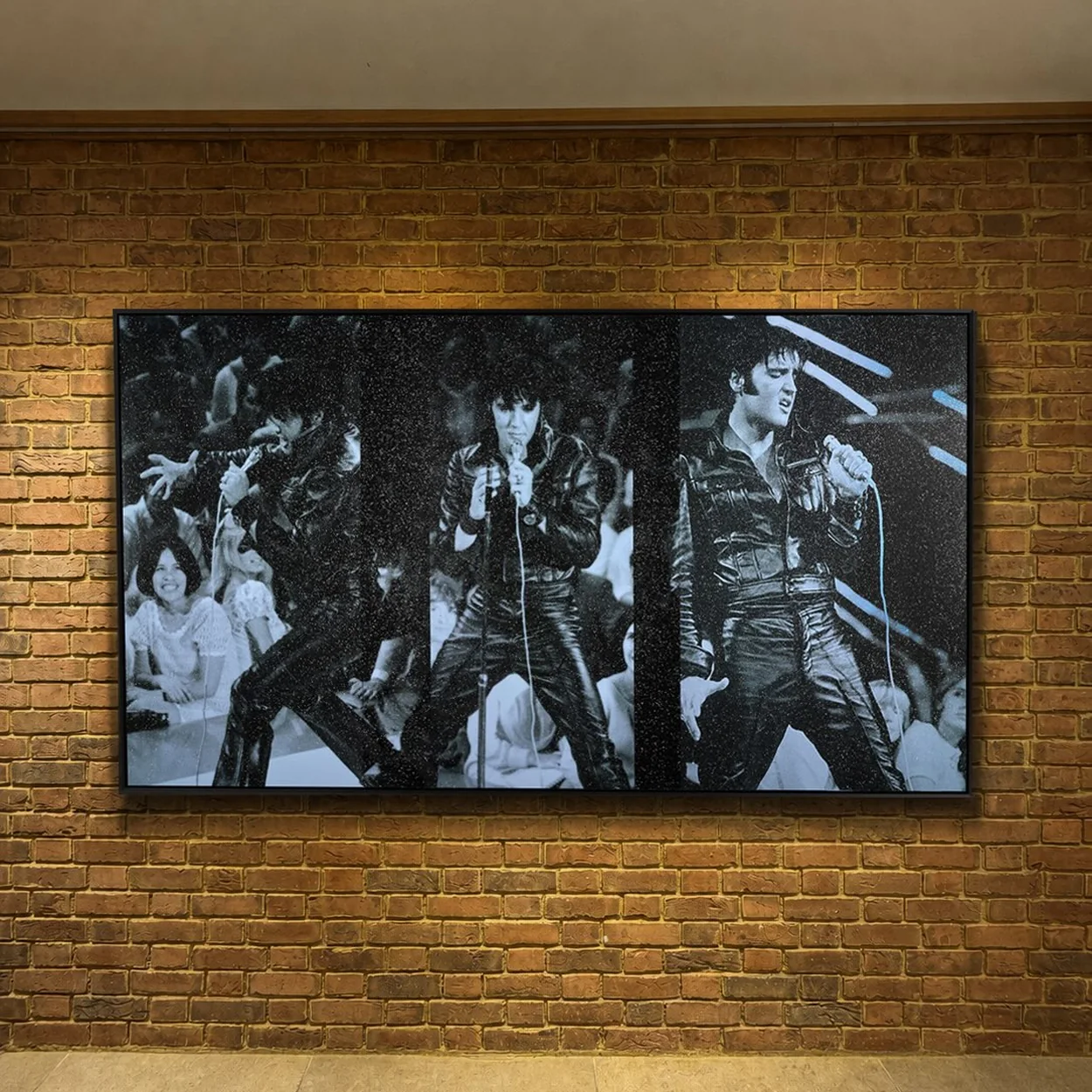 Clarendon Fine Art exposed brick wall hung with a black and white Elvis triptych