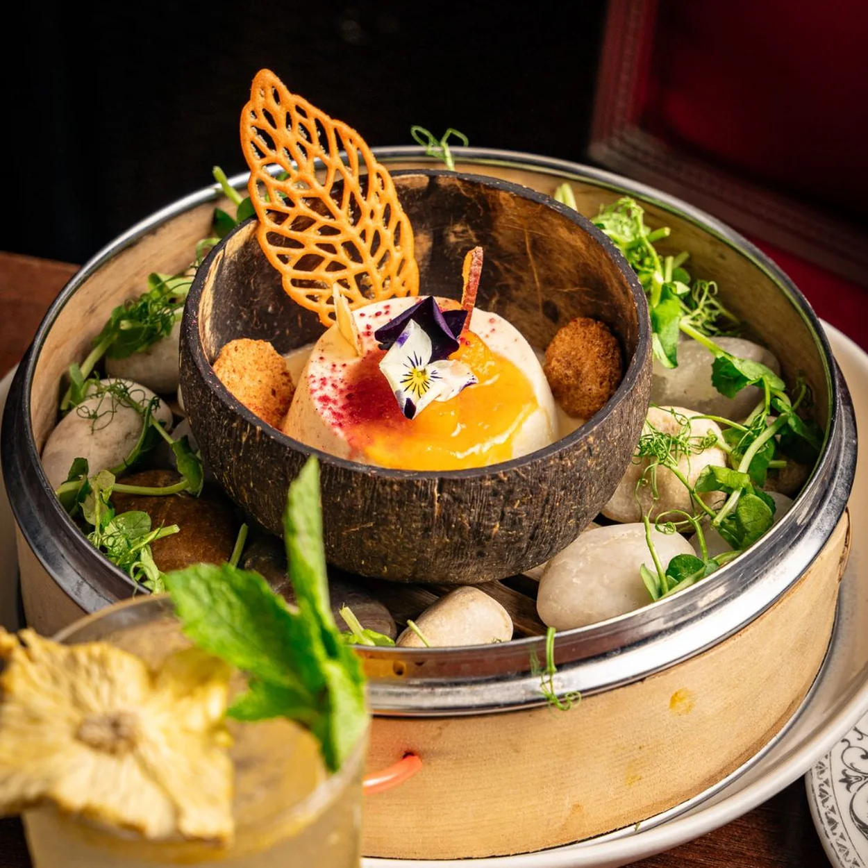 Colonel Saab chaat bowl with a cocktail alongside