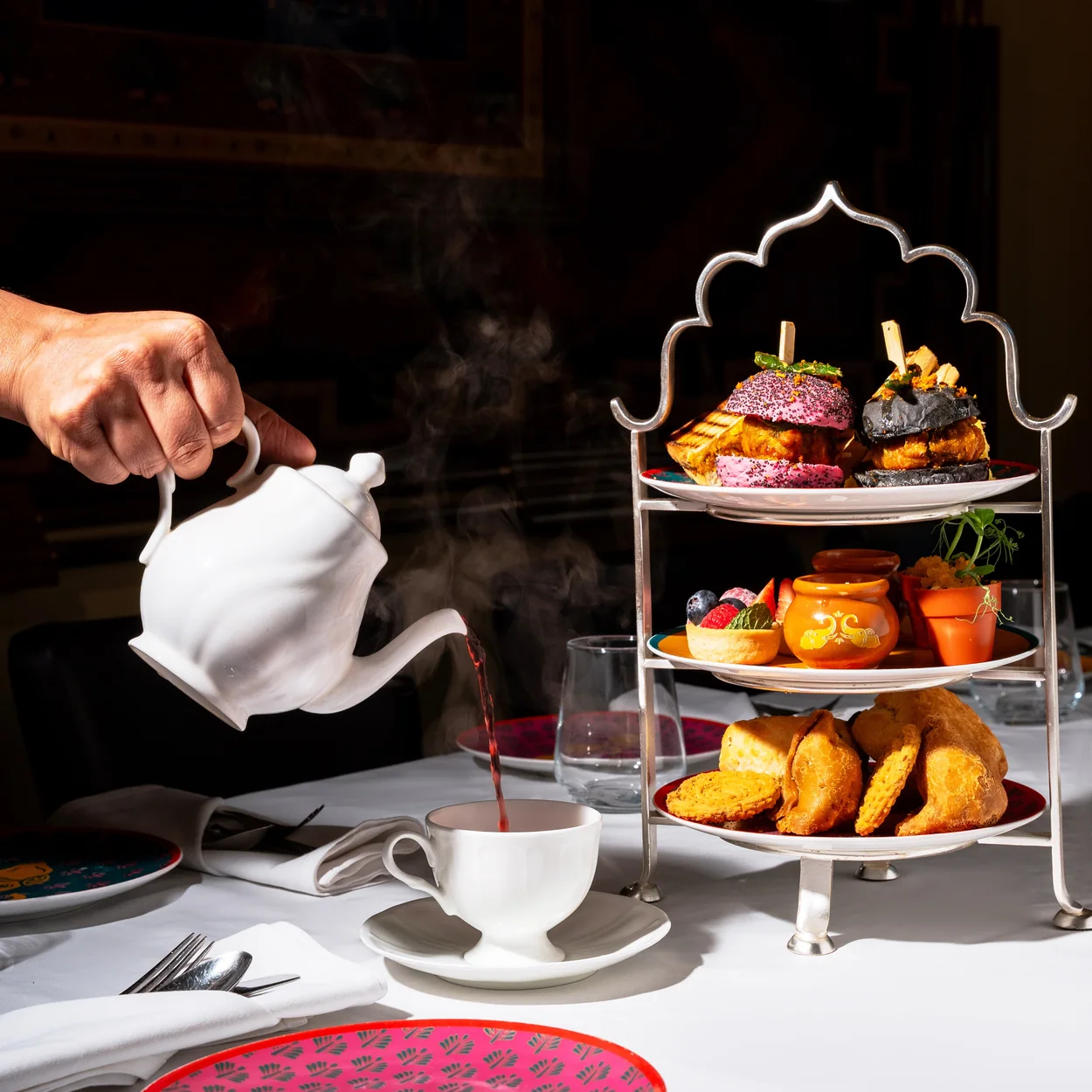 Colonel Saab Indian afternoon tea stand with tea poured from a white pot