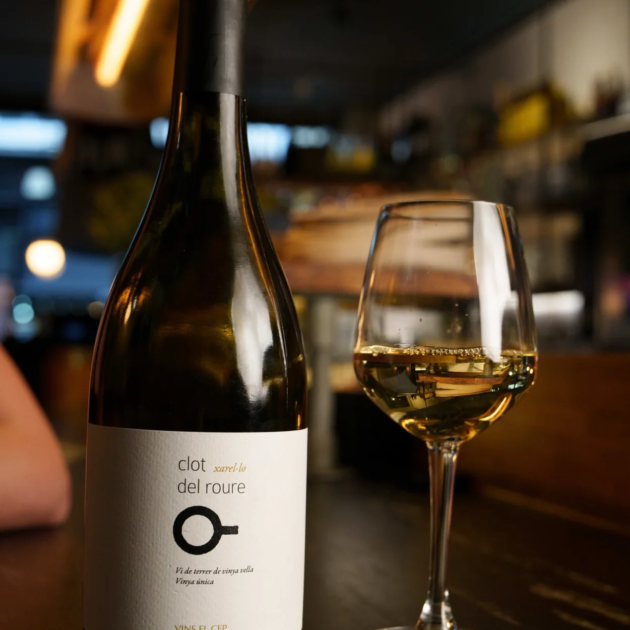 Condesa Covent Garden, a bottle and glass of Spanish white wine at the bar