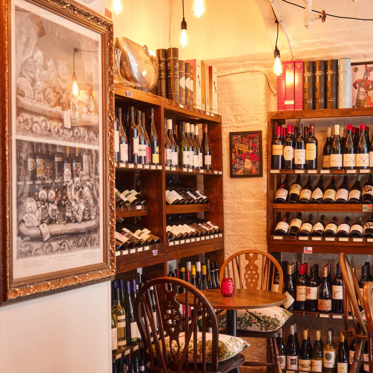Courtyard Wine Cellars wine shelves and framed prints in the shop