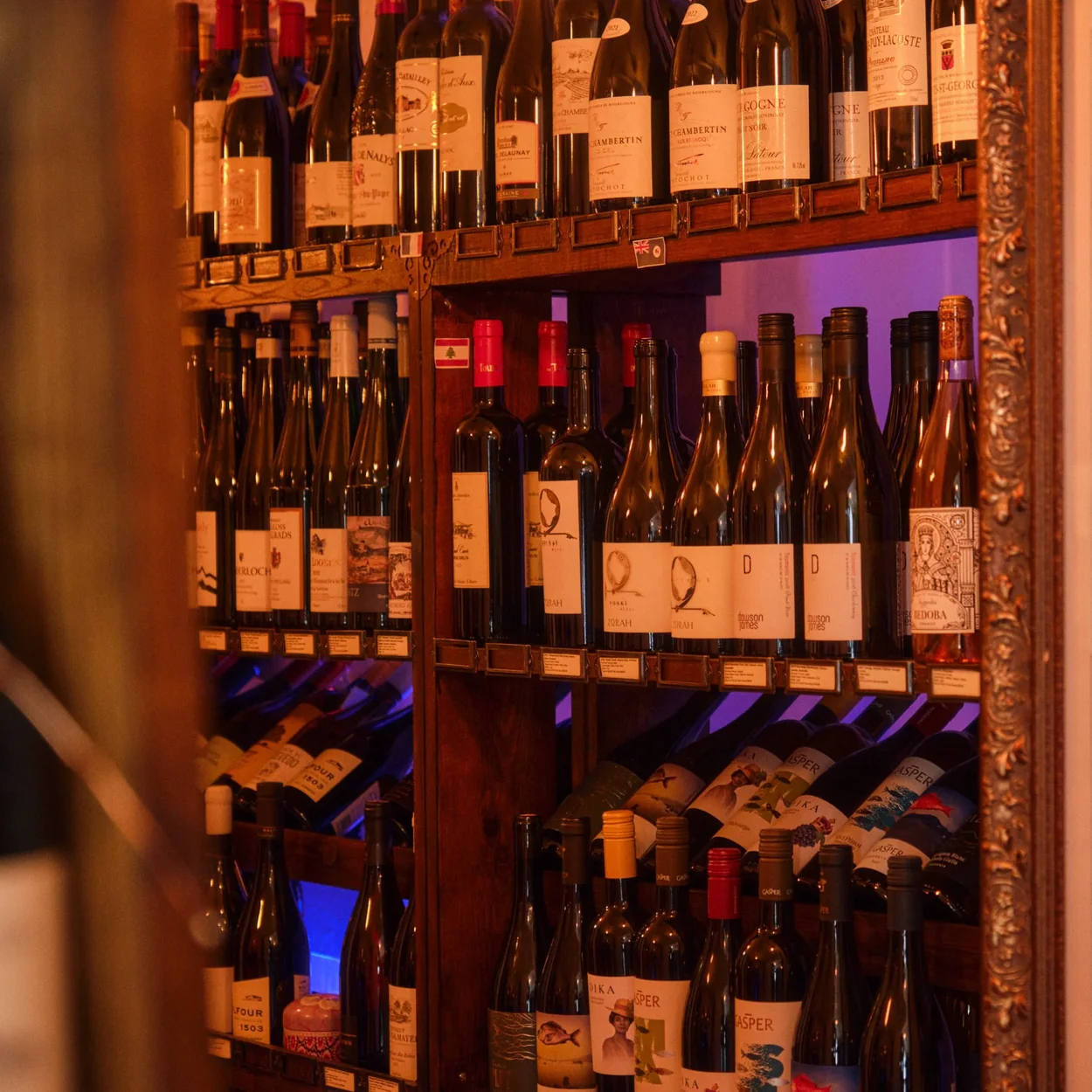 Courtyard Wine Cellars wine racks stocked with bottles