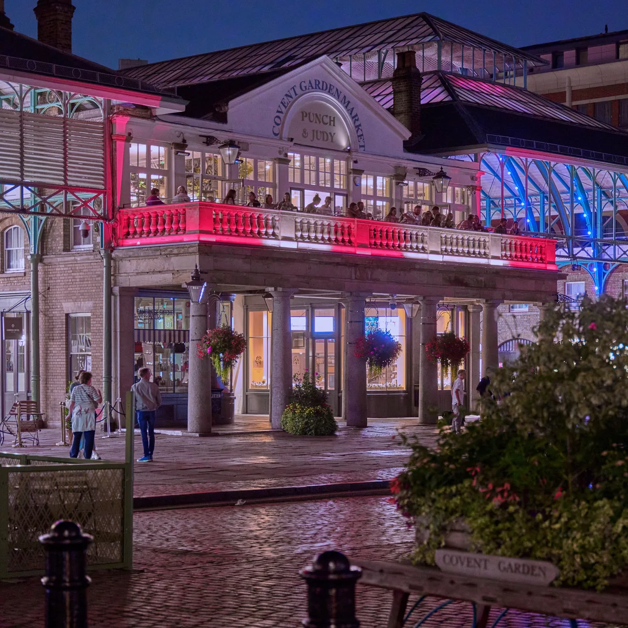 The Covent Garden Market Building east facade at night with lit arches