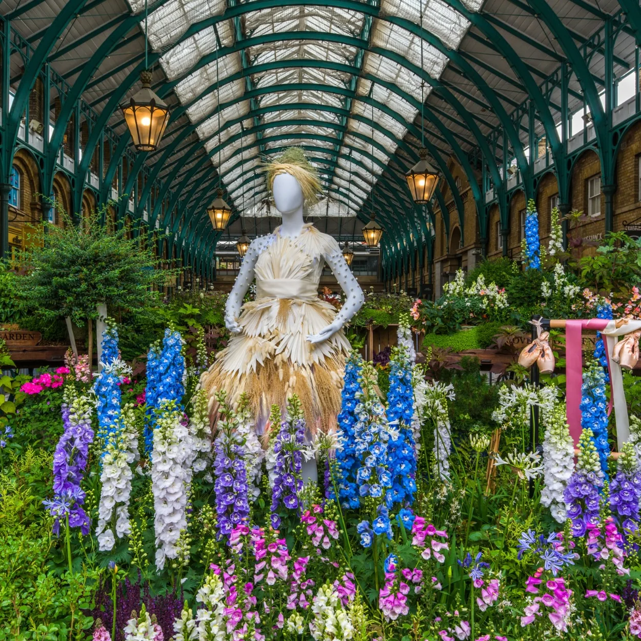 The Covent Garden Market Building central hall with glass roof and floral display