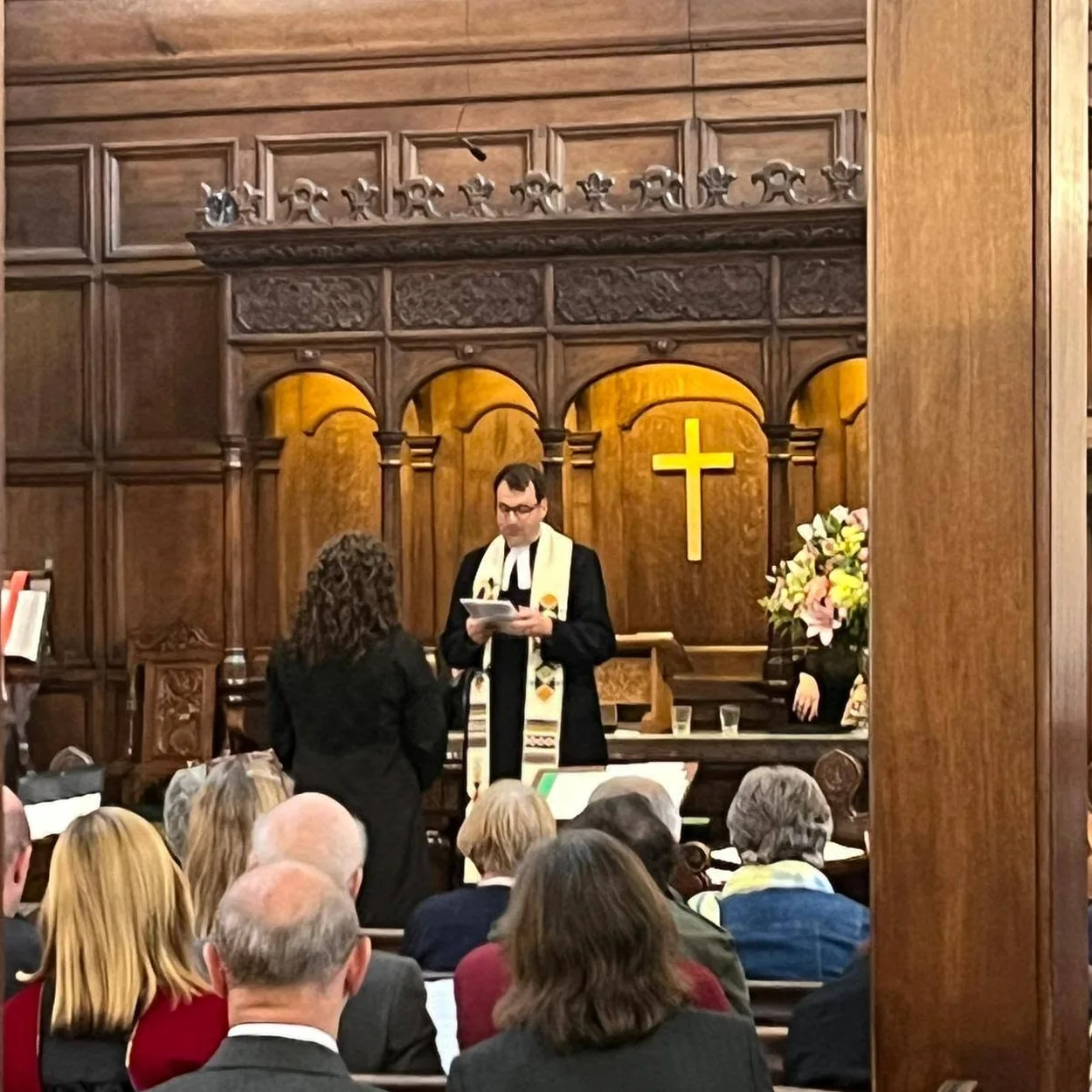 Crown Court Church of Scotland chancel with flowers during a service