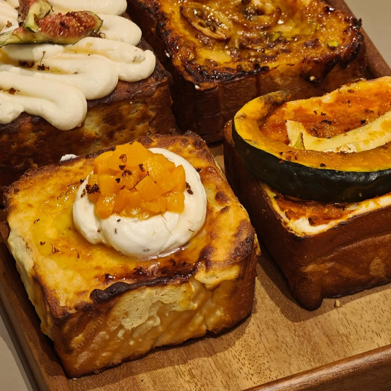 Day Day Drink topped brioche toasts on a wooden board