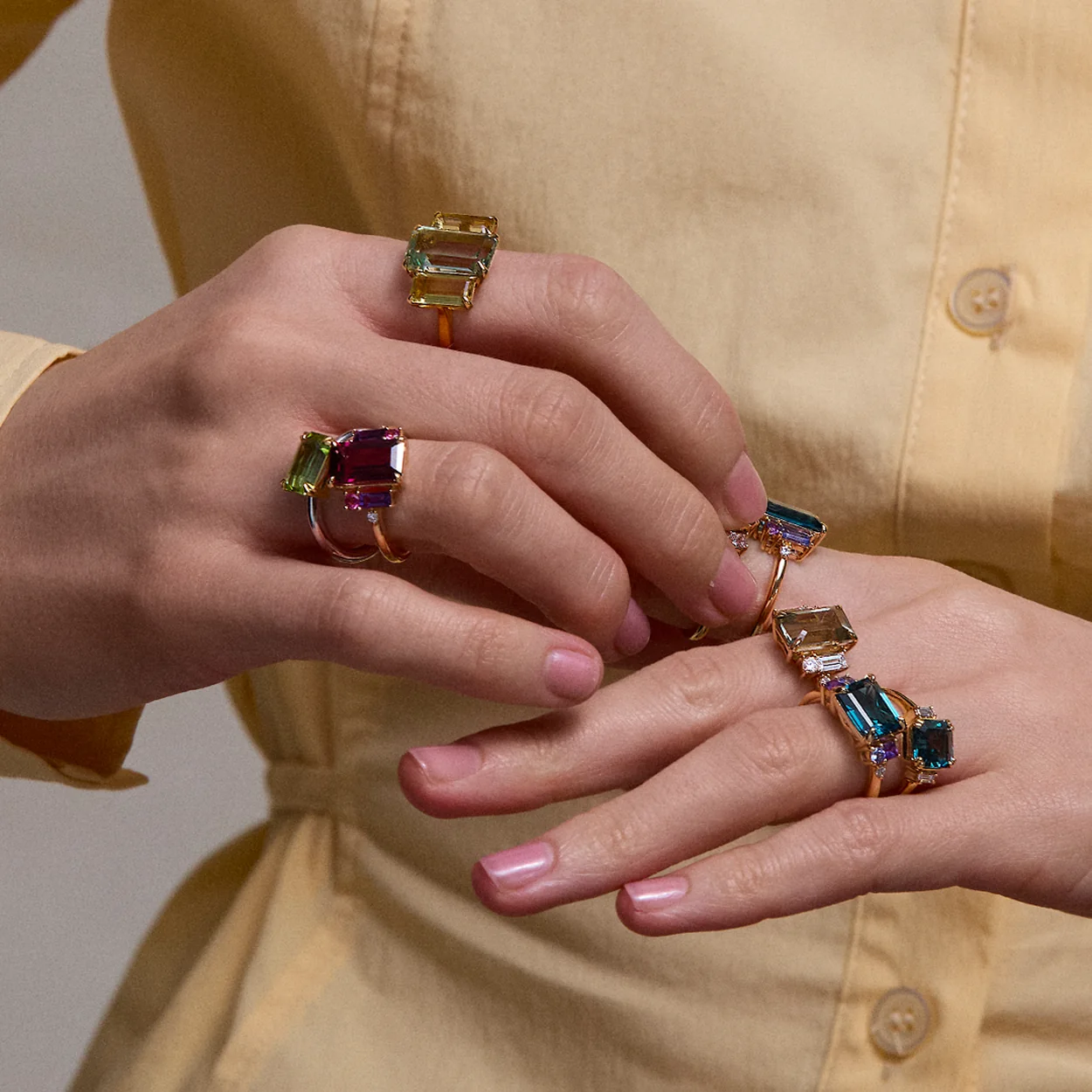 Dinny Hall gemstone rings worn stacked on both hands