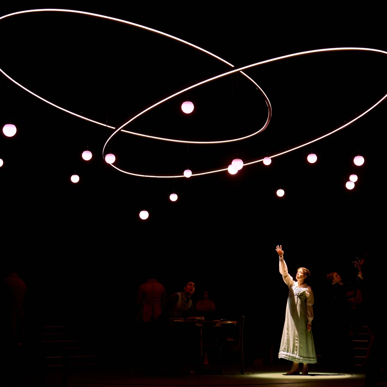 Performance on stage at the Duke of York's Theatre under suspended lights
