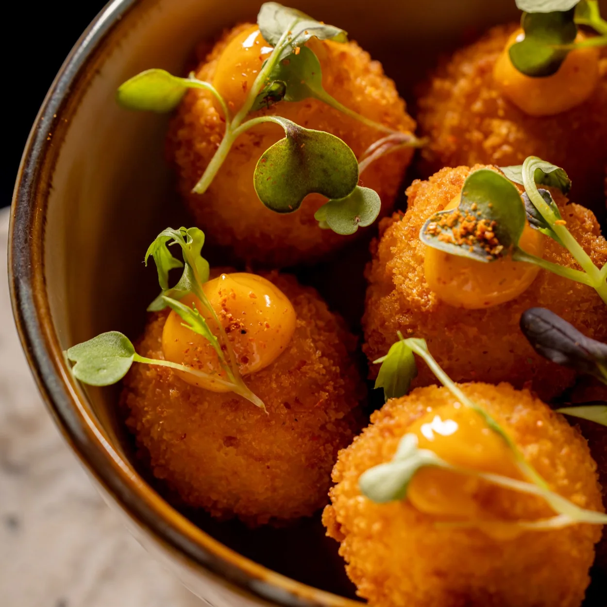 Eve Bar Covent Garden, golden croquettes topped with herbs
