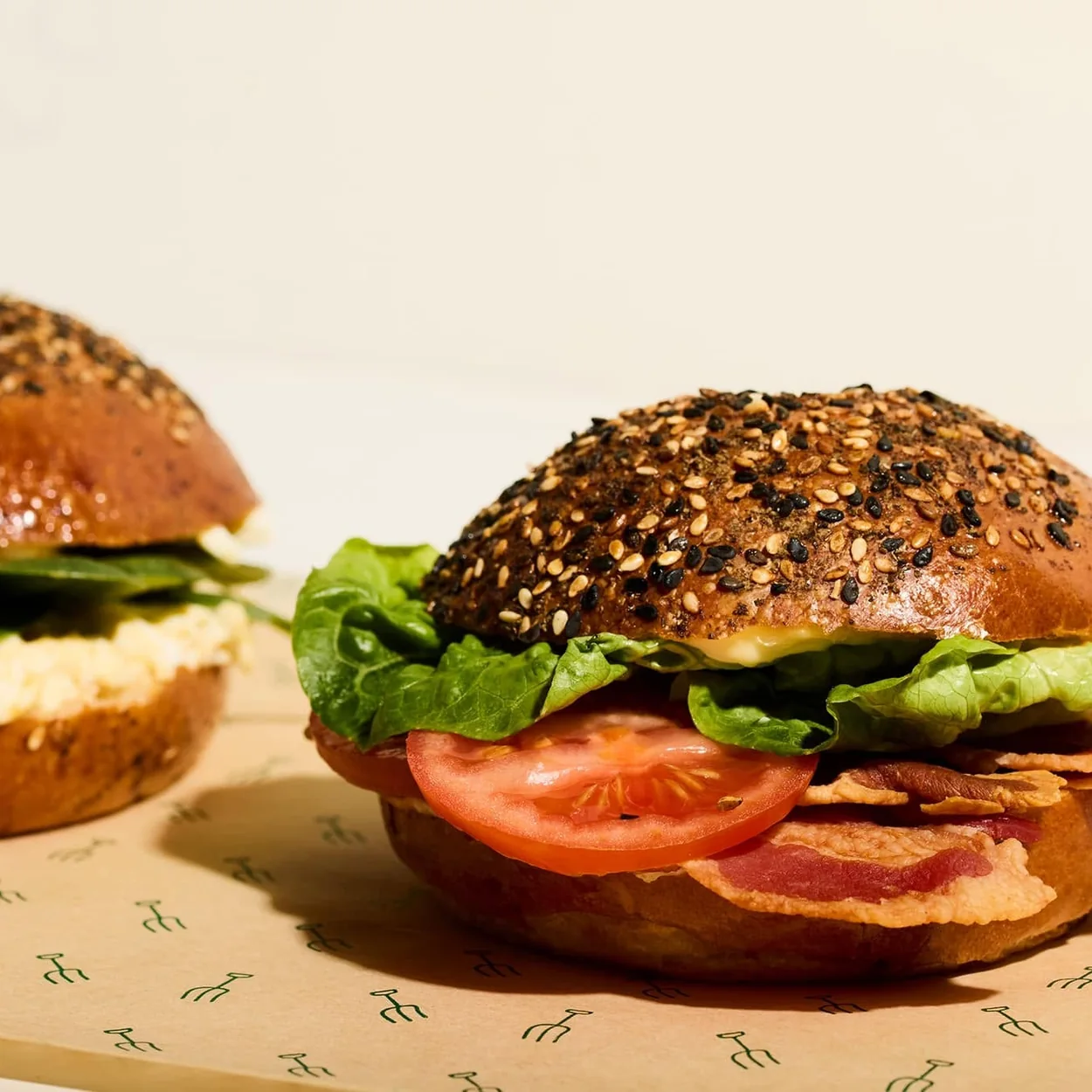 Farmer J seeded breakfast bagel with bacon, egg and tomato