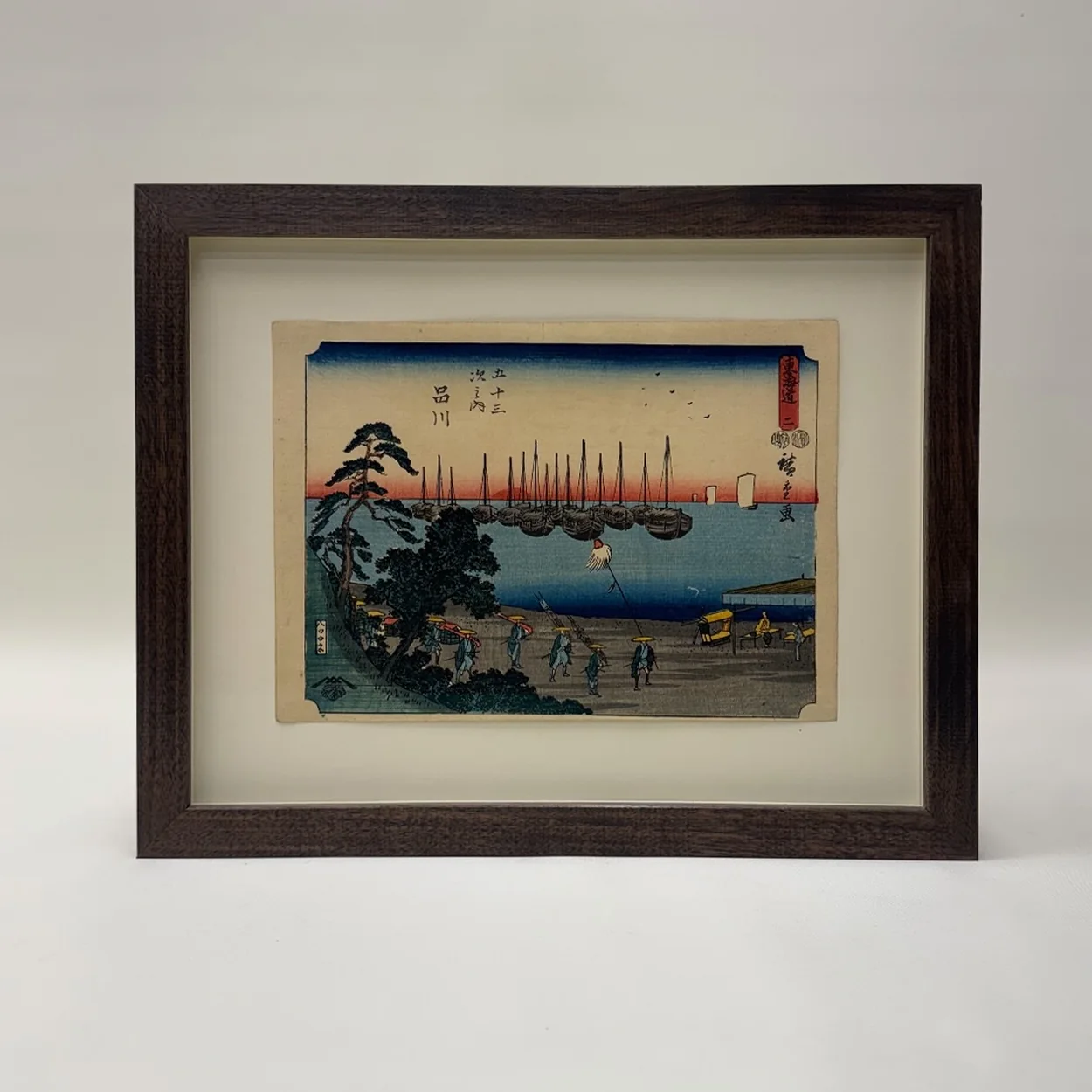 Frame Set & Match dark wood frame and cream mount on a Japanese woodblock print
