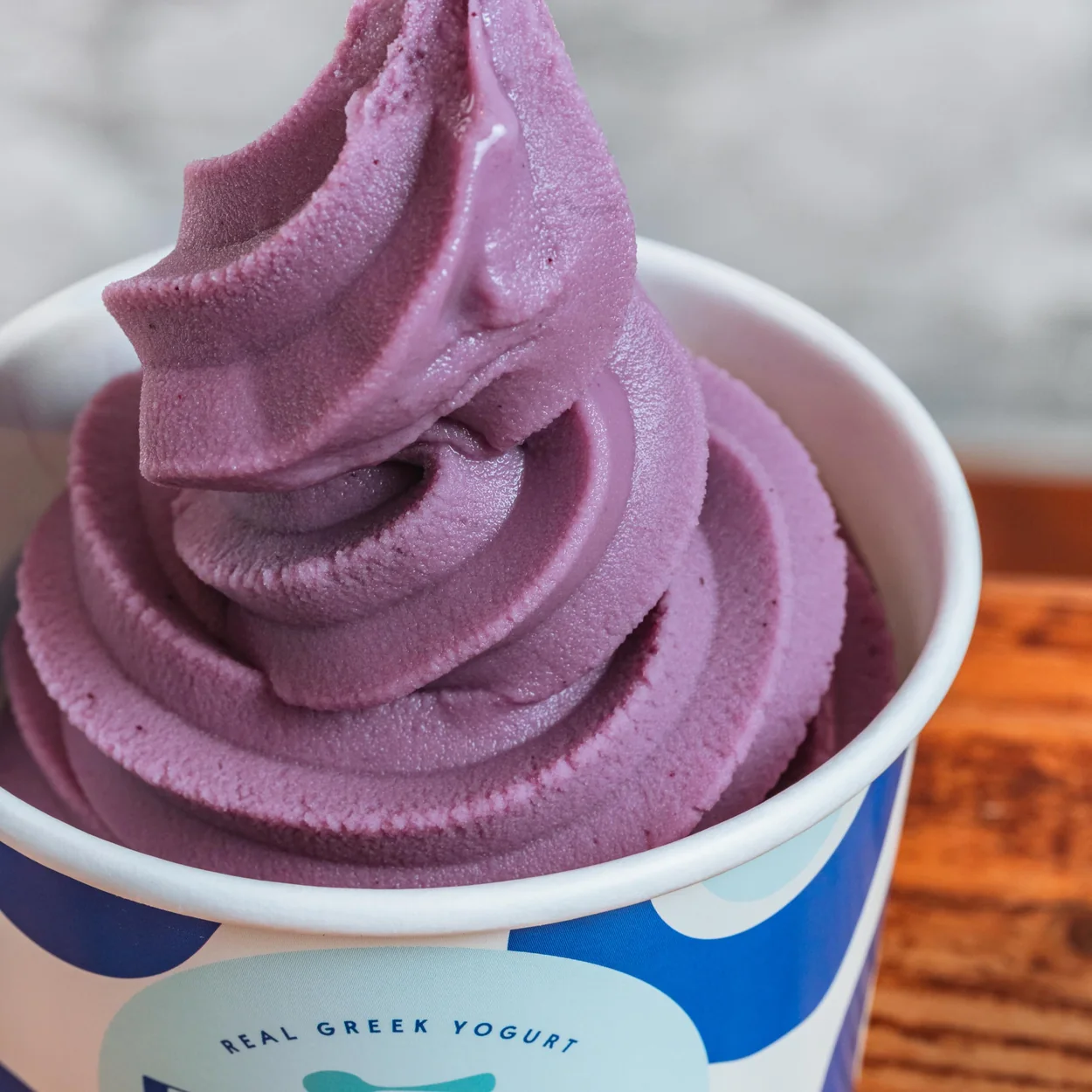 Fresko purple swirled yogurt in a branded cup