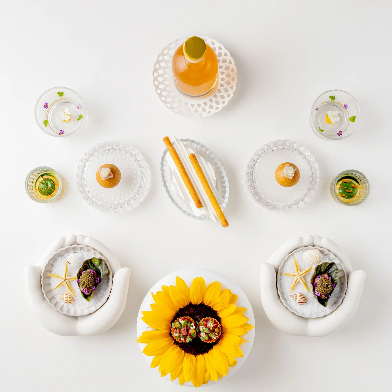 Frog by Adam Handling opening snacks laid out in ceramic and glass vessels