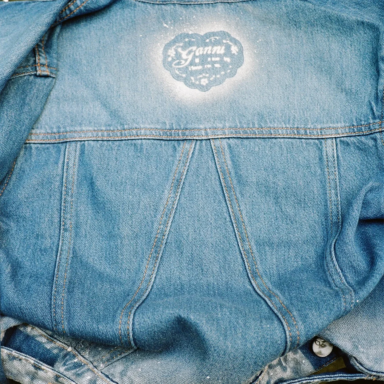 GANNI washed denim jacket with heart logo detail